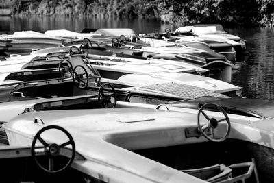 Close-up of boats moored in lake