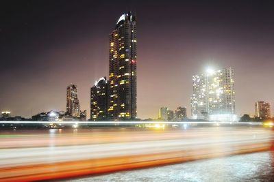 Cityscape with light trails of traffic