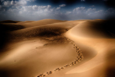 Scenic view of desert against sky