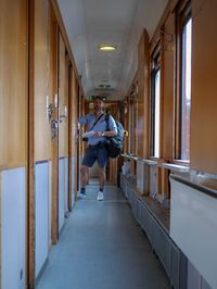 Portrait of man standing in corridor of building