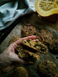 Cropped hand of person holding food