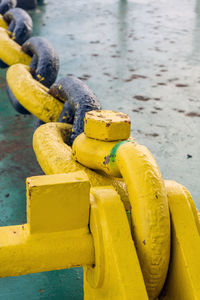 Anchor mooring chain secured to smit bracket on deck of a construction barge at offshore oil field