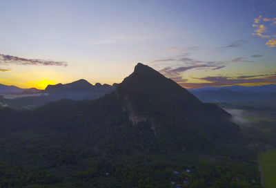 Scenic view of mountains against sky during sunset