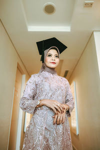 Portrait of a female student celebrating her graduation day