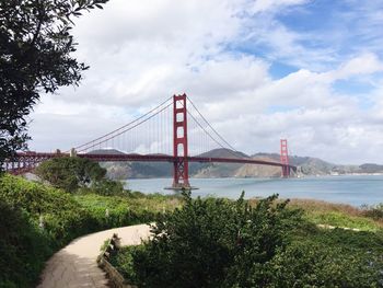 Golden gate bridge over san francisco bay against cloudy sky