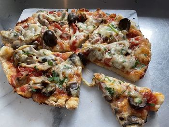 High angle view of pizza in plate on table