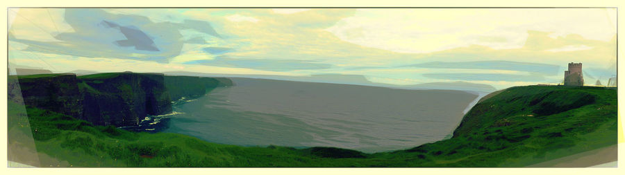 Scenic view of mountains against cloudy sky