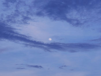 Low angle view of moon in sky at night