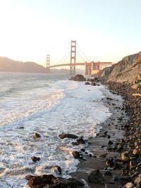 View of suspension bridge over sea