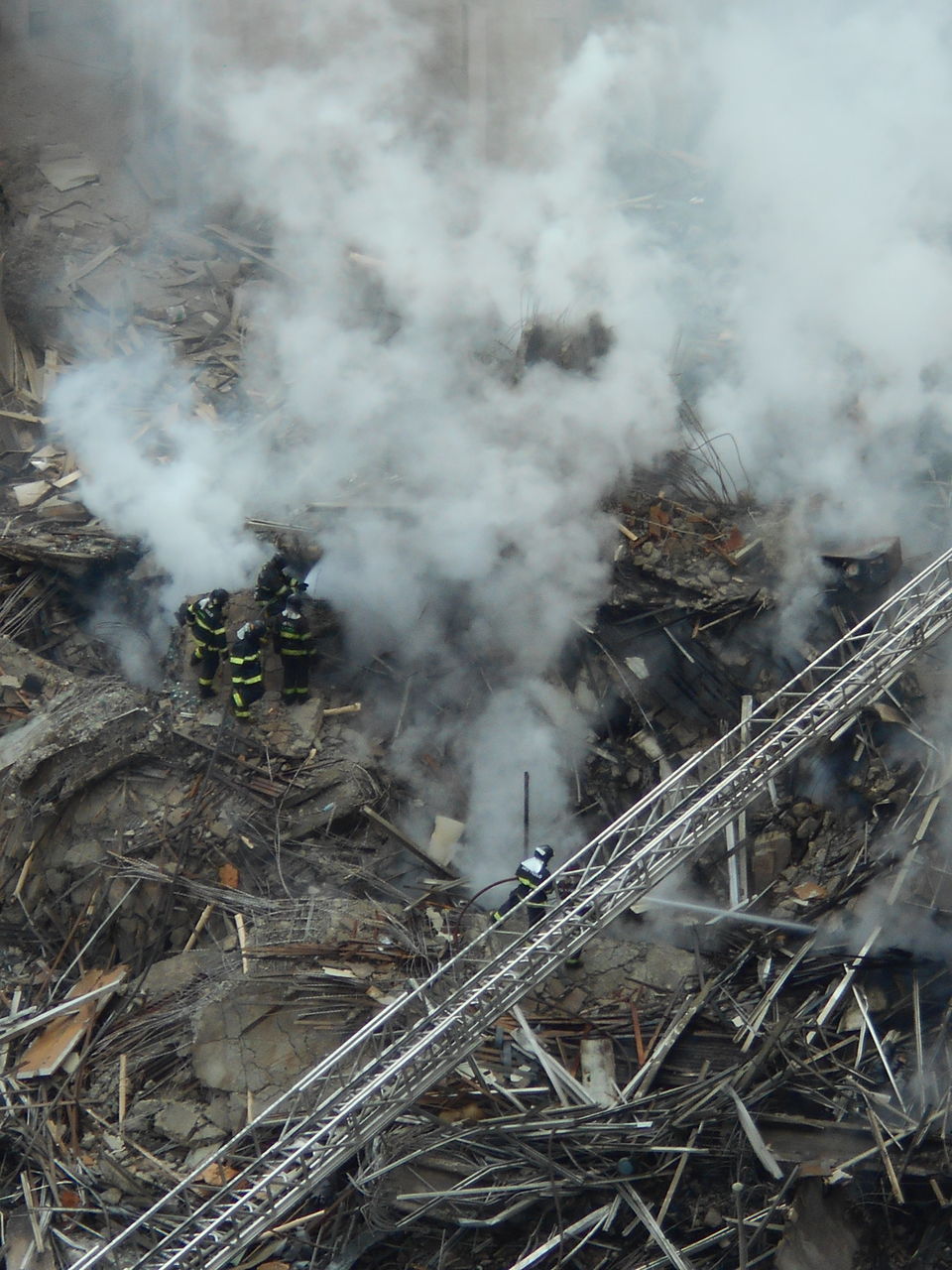 HIGH ANGLE VIEW OF SMOKE EMITTING FROM VOLCANIC MOUNTAIN