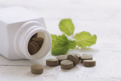 Close-up of herbal medicines on table