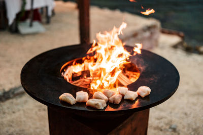 Close-up of burning candles on wood