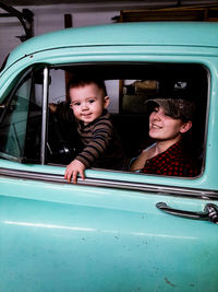 Portrait of a smiling girl in car