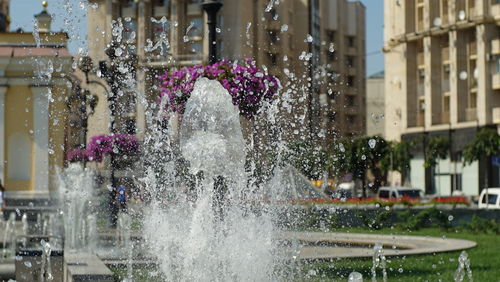 Water splashing on fountain in city