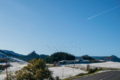 Scenic view of mountains against clear blue sky