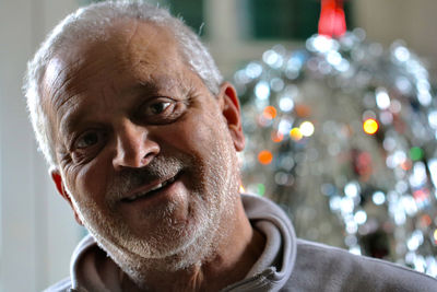 Close-up portrait of smiling man at home