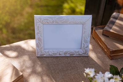 Close-up of white flower on table