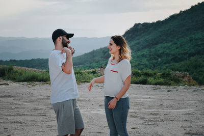 Young couple standing on land