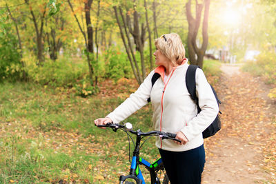 Full length of man riding bicycle in park
