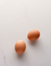 Close-up of egg against white background