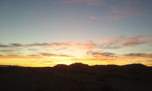 Scenic view of mountains at sunset