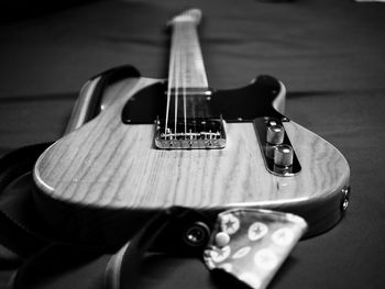 Close-up of guitar on table