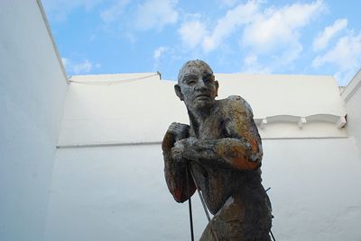 Low angle view of statue against sky