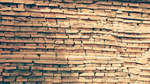 Full frame shot of brick stack of firewood