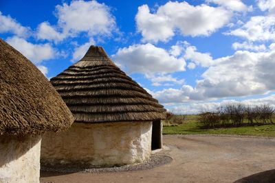 Built structure on land against sky