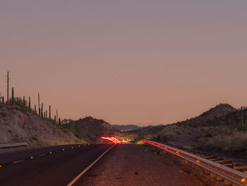 High angle view of light trails on road at night