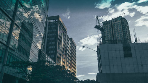 Low angle view of modern buildings against sky