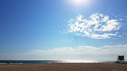 Scenic view of sea against blue sky