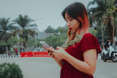 Young woman using mobile phone