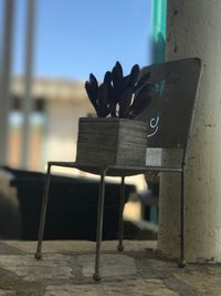 Close-up of chair against sky
