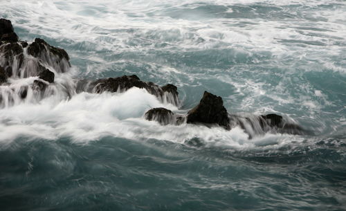 Waves splashing on rocks