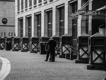 Woman standing in front of building