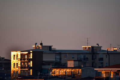 Building illuminated by sunset light