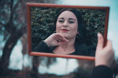 Portrait of a young woman looking away