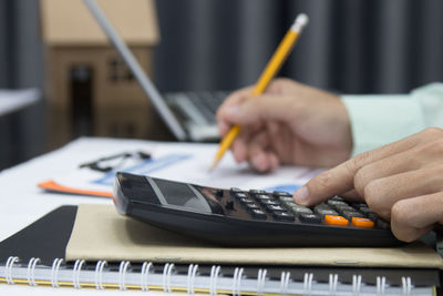 Close-up of man holding paper