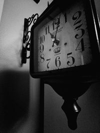 Close-up of clock on wall