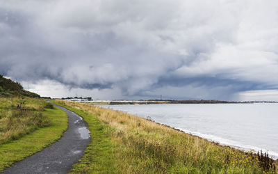 Road by land against sky