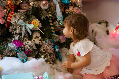 Children playing with toys on christmas tree