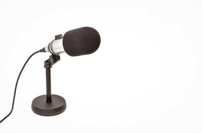 Close-up of microphone against white background