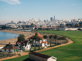 High angle view of buildings in city against sky