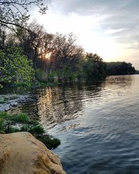 Sun shining over river