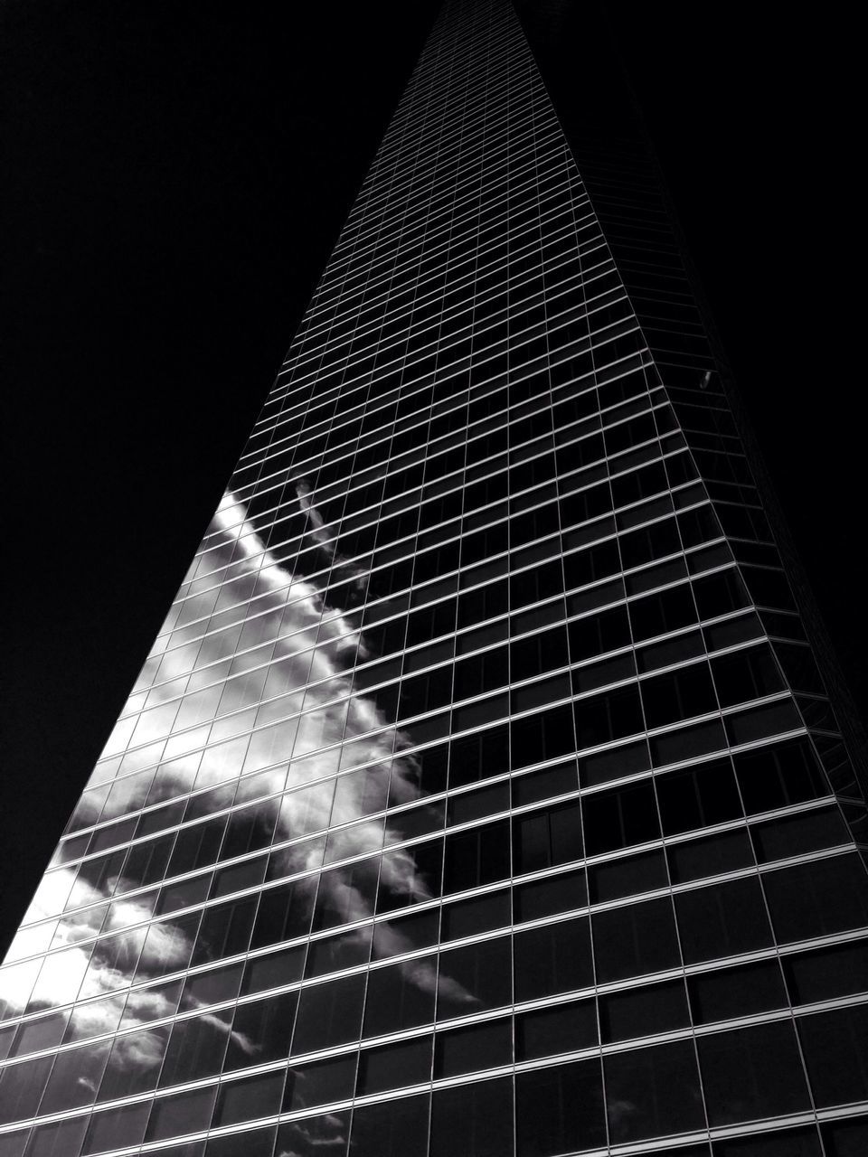 night, low angle view, modern, skyscraper, pattern, building exterior, tall - high, built structure, illuminated, architecture, city, no people, sky, outdoors, office building, tower, glowing, close-up, arts culture and entertainment, reflection