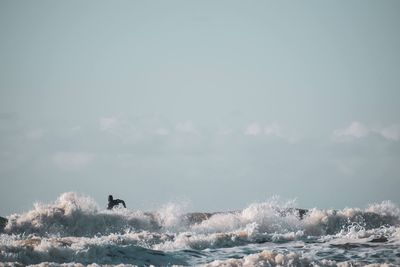 Surfer on sea
