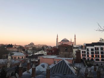 High angle view of townscape against clear sky at sunset