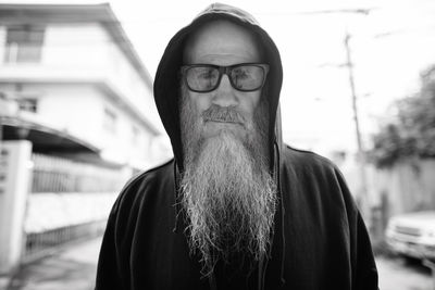 Portrait of senior man standing outdoors