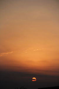 Scenic view of sea against romantic sky at sunset